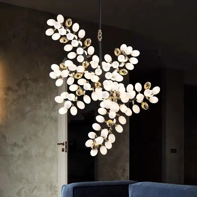 Vynelle chandelier with black and French gold egg-shaped glass design creating warm ambient luxury lighting