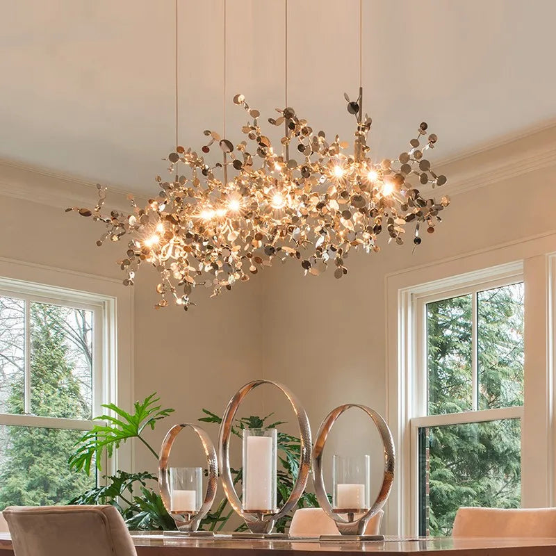 High-quality stainless steel Aurora chandelier with G9 light sources, available in Golden and Chrome finishes. Perfect for living rooms, dining rooms, bedrooms, villas, and lobbies, this versatile design blends luxury and functionality for a brilliant and inviting ambiance.